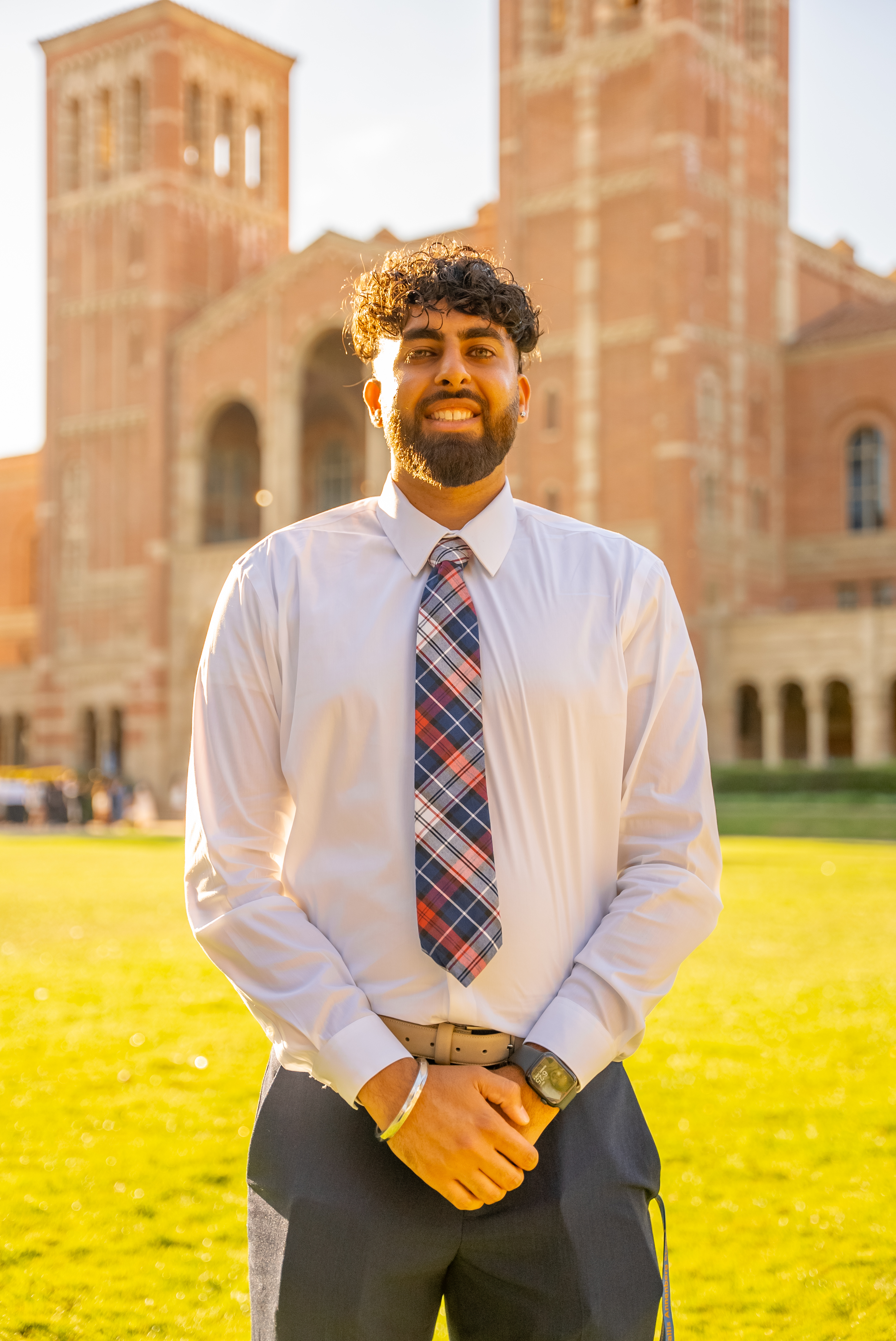 Ashish Singh standing outdoors in front of a university building